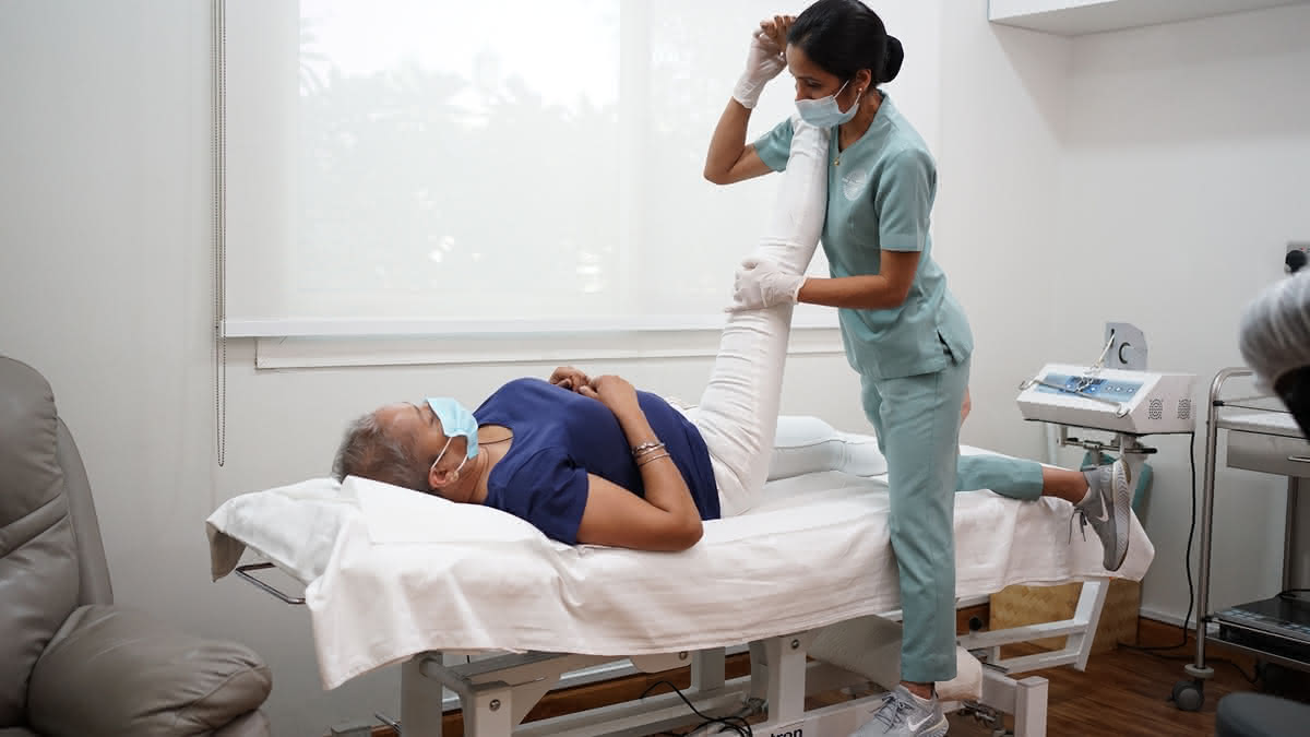 Therapeutic exercise and movement therapy session - Professional physiotherapist guiding patient through evidence-based strengthening and rehabilitation exercises at Healers Clinic Dubai